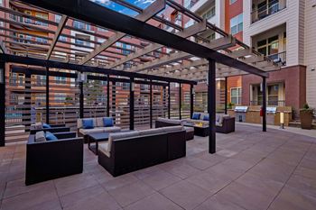 Outdoor bar, grills, and tv area
